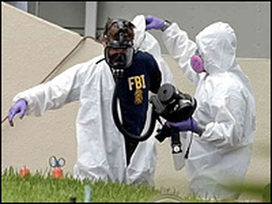 A firefighter decontaminates an FBI agent during the anthrax scare in 2001. Rhona Wise/AFP/Getty
