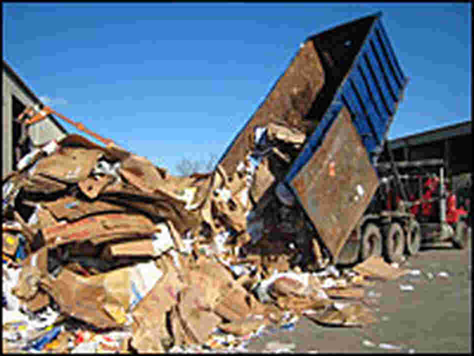 A truck dumps recycled paper at Willimantic Waste Paper Co.
