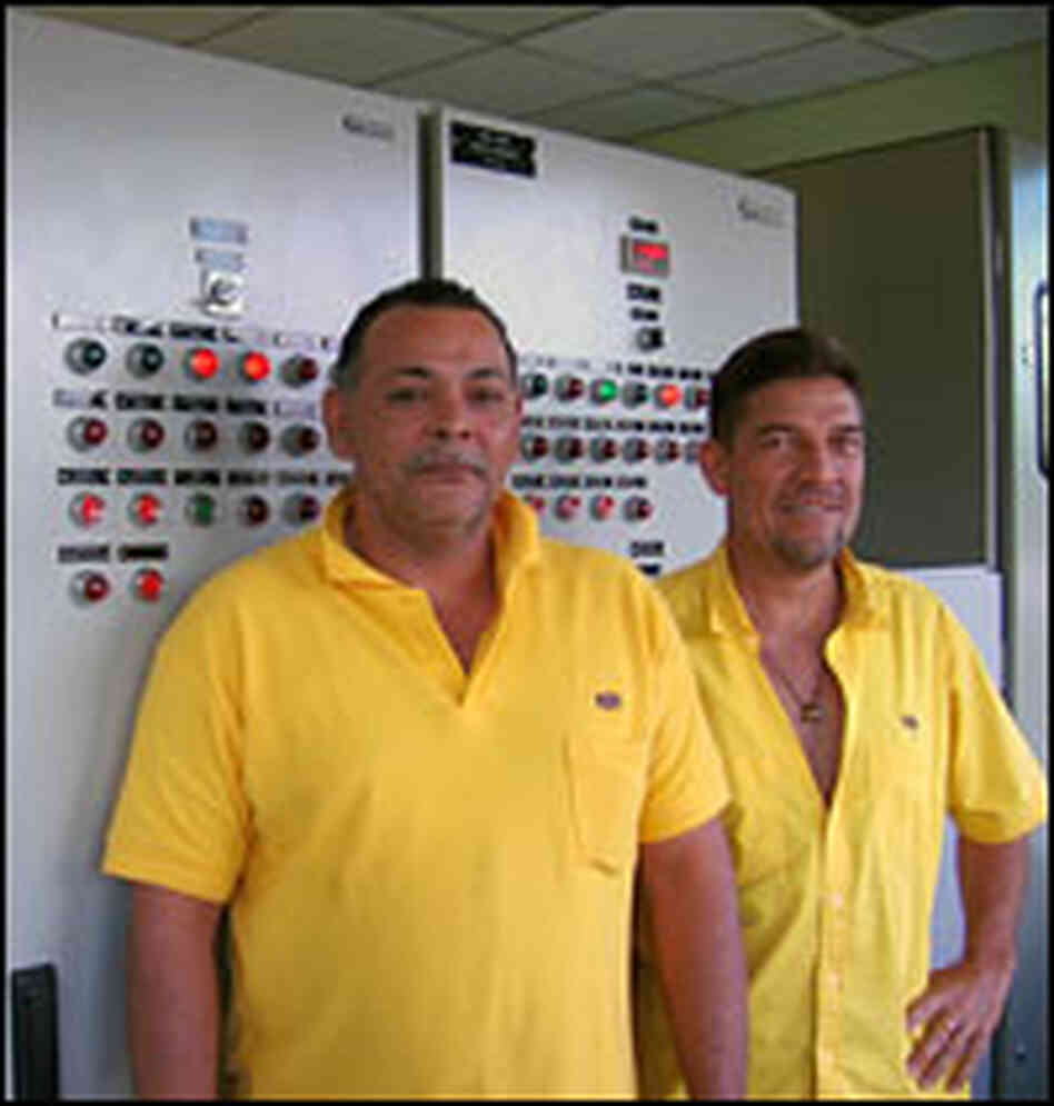 Technicians at the Angostura plant monitor water levels and electrical output.