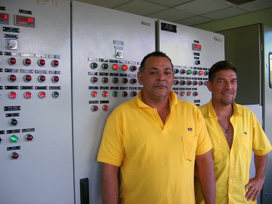 Technicians at the Angostura plant monitor water levels and electrical output.