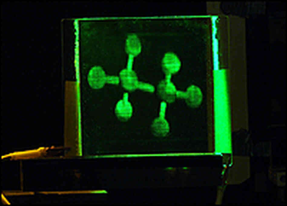 A holographic 3-D image of an ethane molecule. A holographic 3-D image of an ethane molecule.