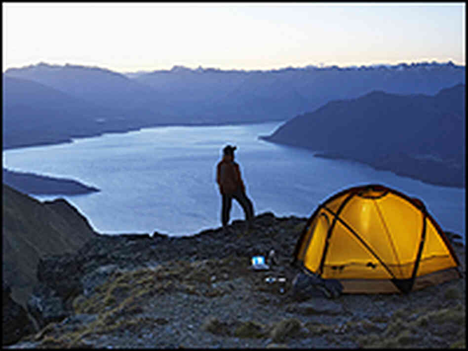 Camper in mountain range Camper in mountain range