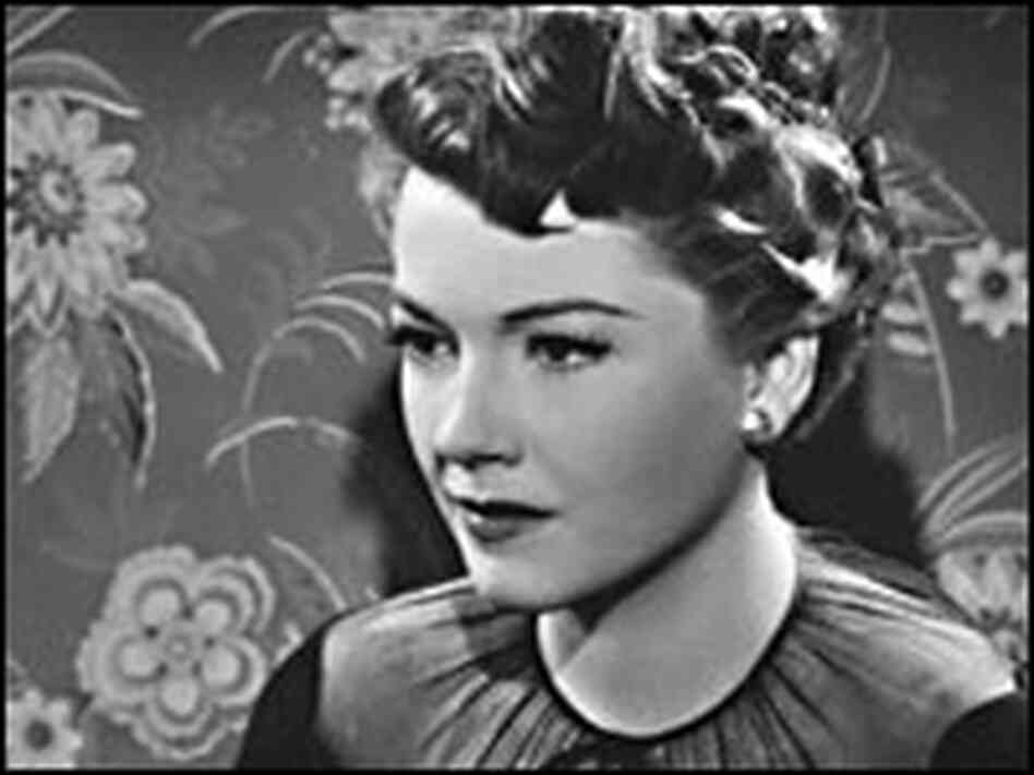 Anne Baxter (with Celeste Holm, left, in enlargement) on sofa in 'All About Eve'