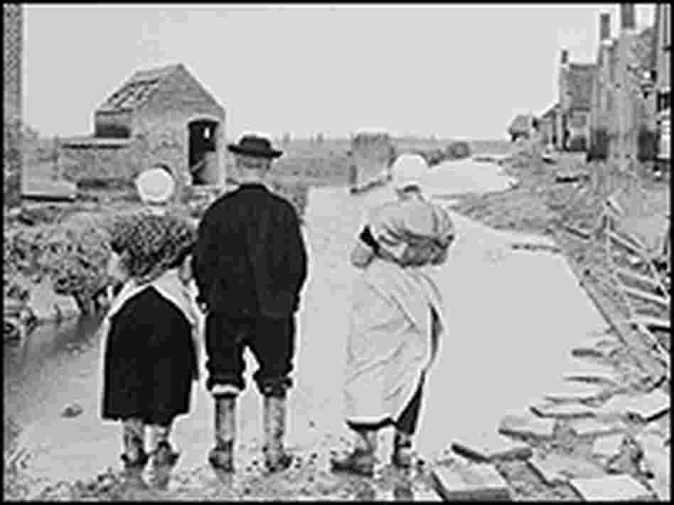 Netherlanders return to their homes after the 1953 flood.