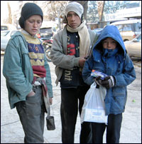 Ruzadin, 11, stands with fellow street children in Kabul.