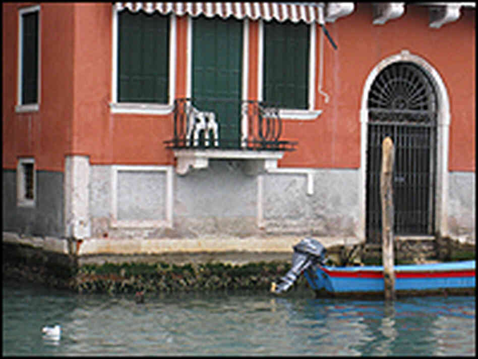 Boat in front of a house in Venice.