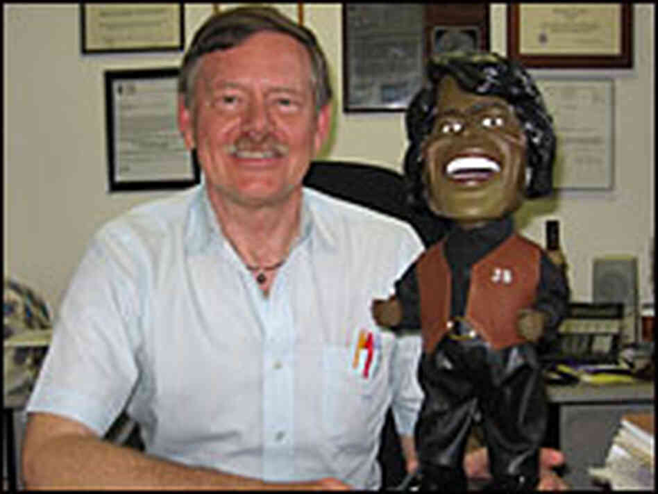 Attorney William Coulson with a James Brown doll.