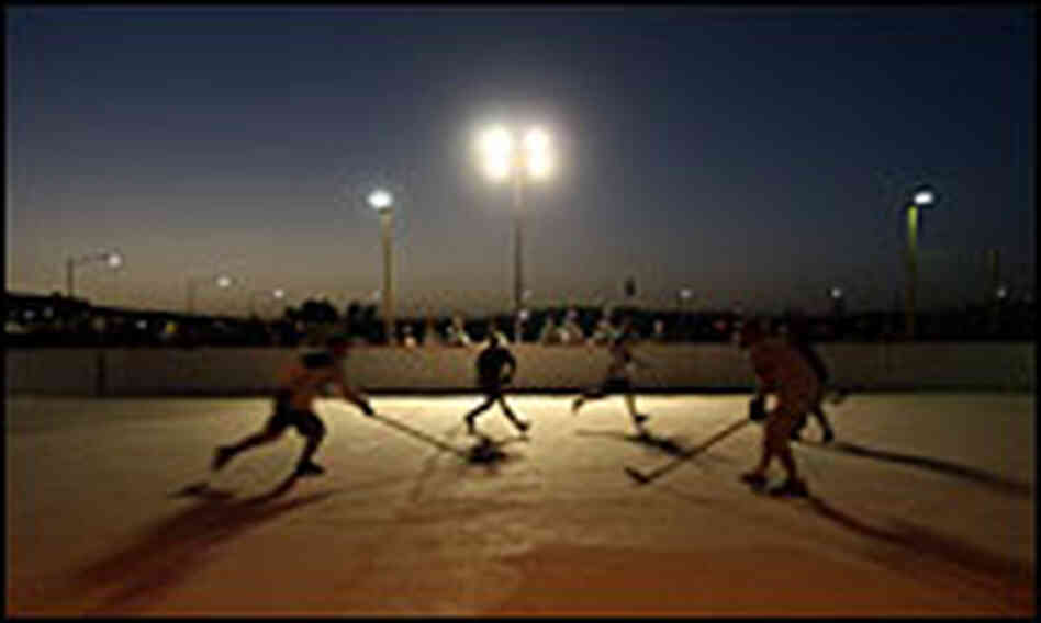 Canadian soldiers playing hockey at Kandahar Air Base Canadian soldiers playing hockey at Kandahar Air Base
