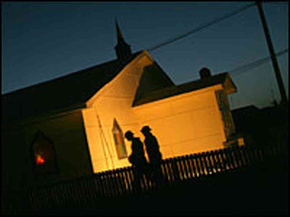 NATO soldiers walking past chapel