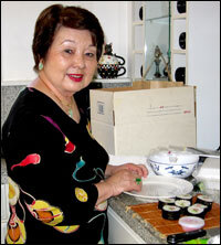 Hawaiian cookbook author Muriel Miura makes Spam sushi.