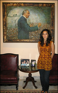 Fatima Bhutto stands in front of a painting of her grandfather, Zulfikar Ali Bhutto.