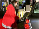 Michelle Carvalho fills up her gas tank. Michelle Carvalho fills up her gas tank.