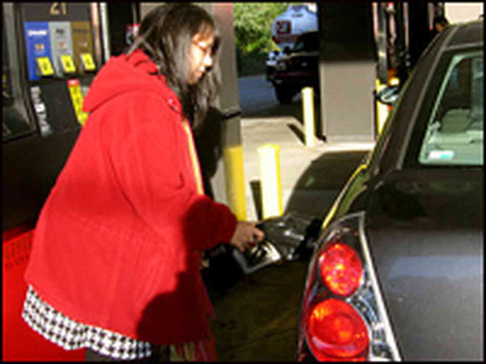Michelle Carvalho fills up her gas tank.