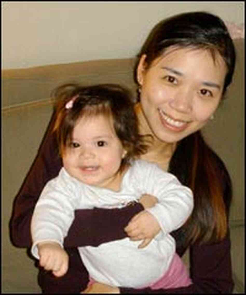 Researcher Yaling Yang at home with her daughter, Zoe.