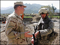 Navy Cmdr. Larry Legree (left) discusses the bridge projects with Lt. Matt Myers. Until recently, the two were members of the U.S. provincial reconstruction team, or PRT, in Kunar province.
