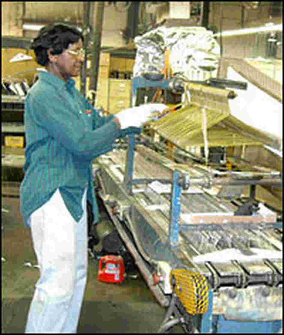 Selma Boyd packs hangers at M&B Hangers in Leeds, Ala.