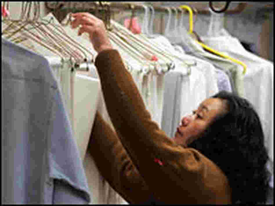 A worker checks a rack at a San Francisco dry cleaner, Jan. 29, 2007.