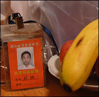 The body of Liu Qiang, 17, was one of the last to be pulled from the school's rubble on Wednesday. His student ID and fruit have been placed on an altar for Liu in his family's home.