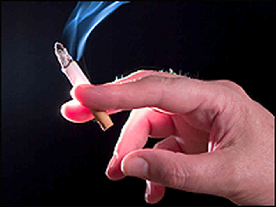 Hand holding cigarette Hand holding cigarette