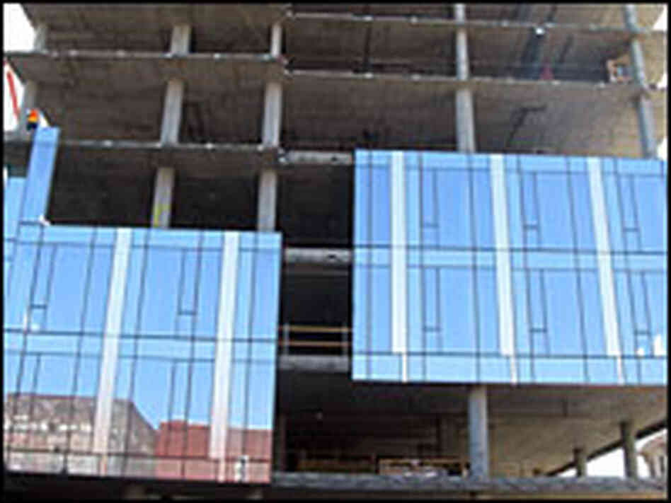 A building under construction in Portland, Ore., will have an energy-efficient glass facade.