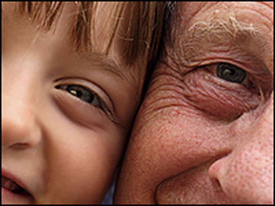 A close-up photo of an older man and a young child A close-up photo of an older man and a young child