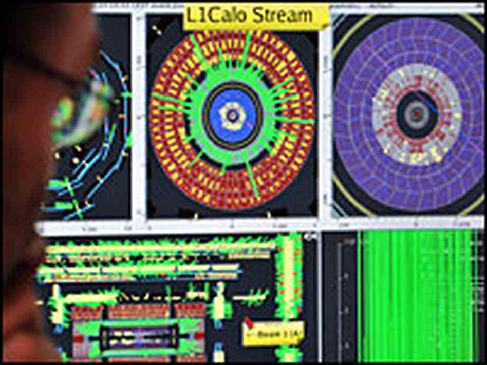 A CERN scientist monitors a computer that tracks protons injected into the Large Hadron Collider A CERN scientist monitors a computer that tracks protons injected into the Large Hadron Collider