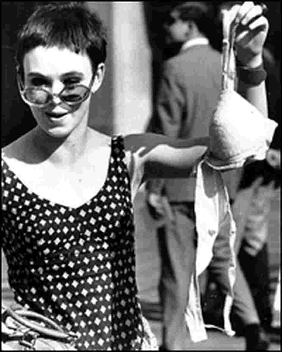 An unidentified member of the Women's Liberation Party drops a brassiere in the trash