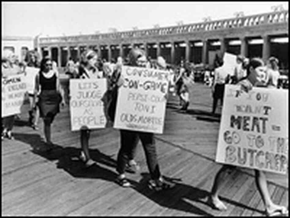 Demonstrators from the National Women's Liberation Party picket with signs