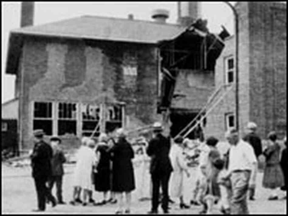 People stand outside the Bath school after the bombing.