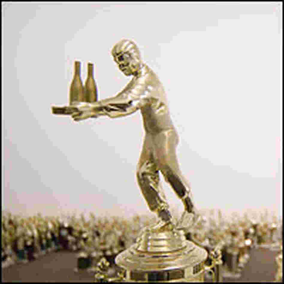 Trophy figure serving a tray with bottles