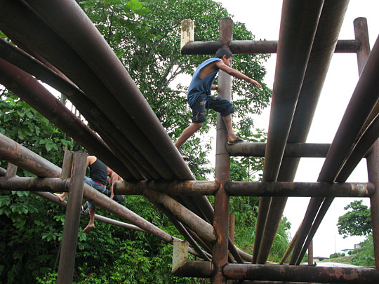 Children now use oil pipelines as makeshift jungle gyms.