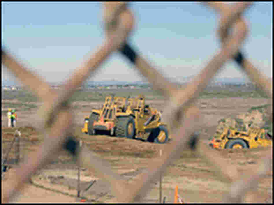 Bulldozer working on the U.S. side of the border.