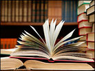 A stack of books in a library. A stack of books in a library.
