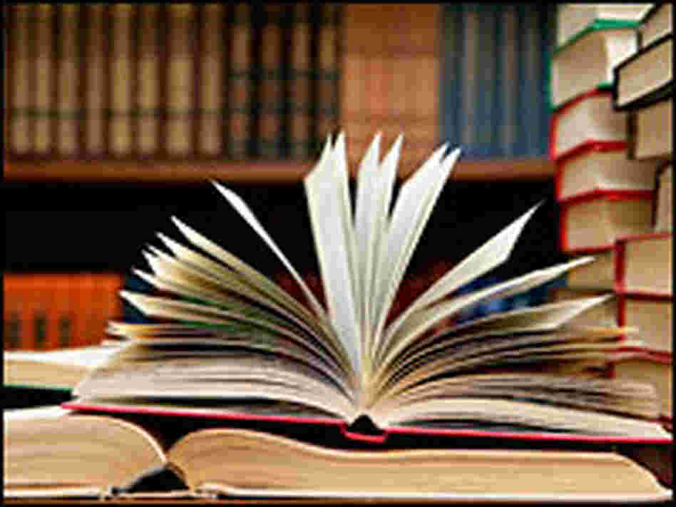 A stack of books in a library. A stack of books in a library.