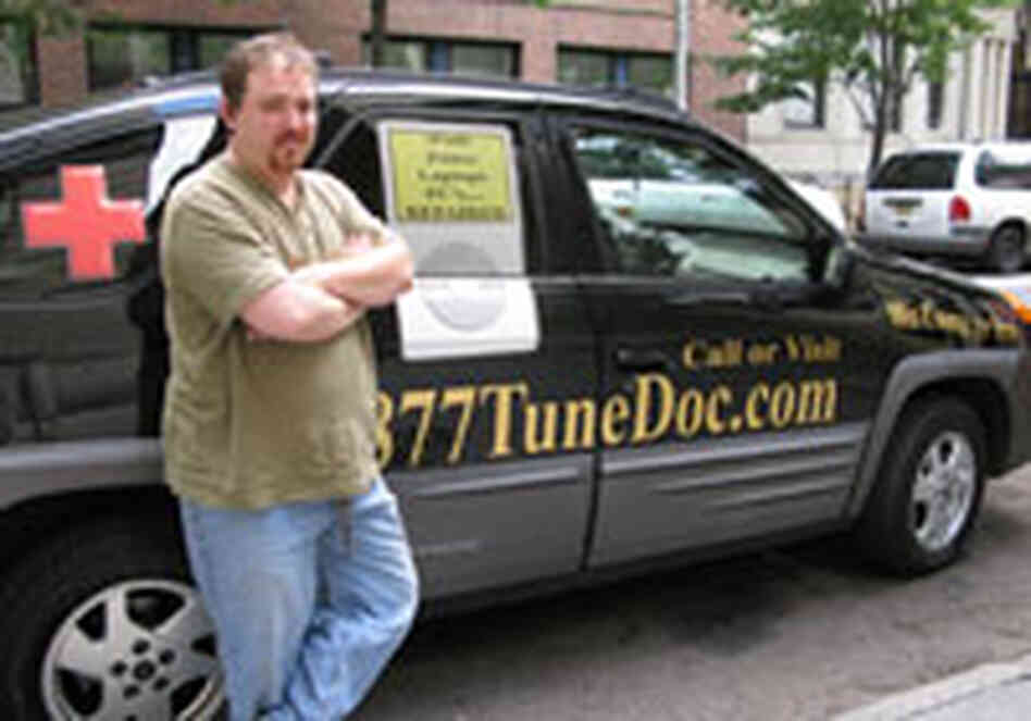 Demetri Leontaris stands by the van that advertises — and houses - his business. Demetri Leontaris stands by the van that advertises — and houses - his business.