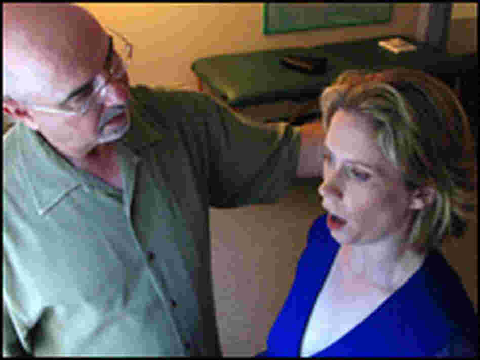 Teacher Edward Bilanchone instructs Soprano Alexandra Phillips in breathing techniques.