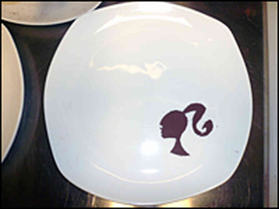 Even the plates in the Barbie restaurant are dusted with chocolate likenesses of the famous 11 1/2 i