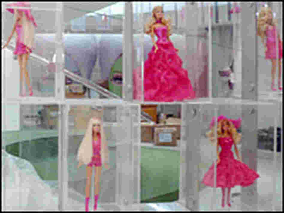 A wall of a thousand pink-clad Barbies is at the heart of the House of Barbie.