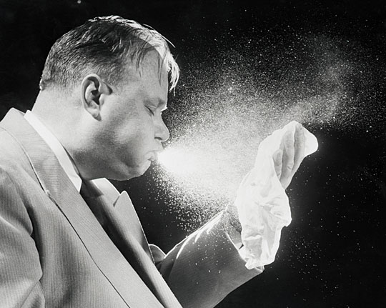 A sneeze recorded at high speed.  On average, droplets can travel between 3 to 6 feet, carrying flu