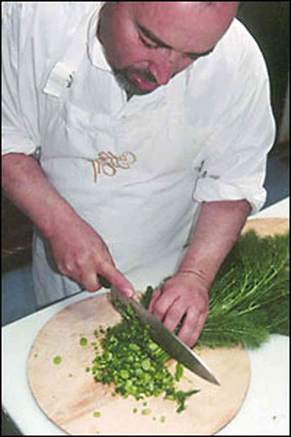 Angelo Garro chops wild fennel for a meal Angelo Garro chops wild fennel for a meal