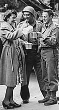 U.S. soldiers are served coffee during World War II