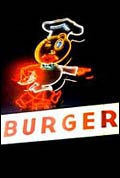 Speedy, the original McDonald's mascot, in neon