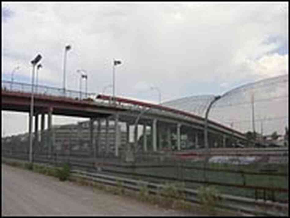 Footbridge crosses the Rio Grande and layers of fences into Mexico Footbridge crosses the Rio Grande and layers of fences into Mexico