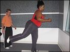 Sports medicine expert Ronda Wimmer, left, watches as Farai Chideya does a leg stretch Sports medicine expert Ronda Wimmer, left, watches as Farai Chideya does a leg stretch