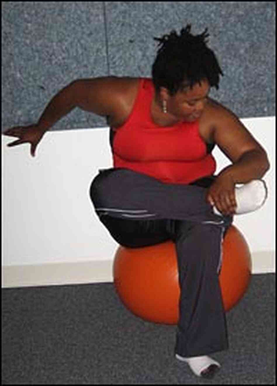 Farai Chideya stretches on an exercise ball. Farai Chideya stretches on an exercise ball.