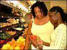 Farai Chideya, left, and Dr. Ro cruise the produce section Farai Chideya, left, and Dr. Ro cruise the produce section