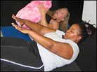 Farai Chideya and Dianne Solomons do abdominal exercises at Gold's Gym in Redondo Beach, Calif. Farai Chideya and Dianne Solomons do abdominal exercises at Gold's Gym in Redondo Beach, Calif.