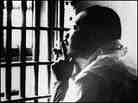 The Rev. Martin Luther King, Jr., sits in a jail cell, October 1967. The Rev. Martin Luther King, Jr., sits in a jail cell, October 1967.