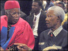 Chinua Achebe sitting next to Nelson Mandela Chinua Achebe sitting next to Nelson Mandela