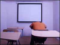 Girl sitting in detention